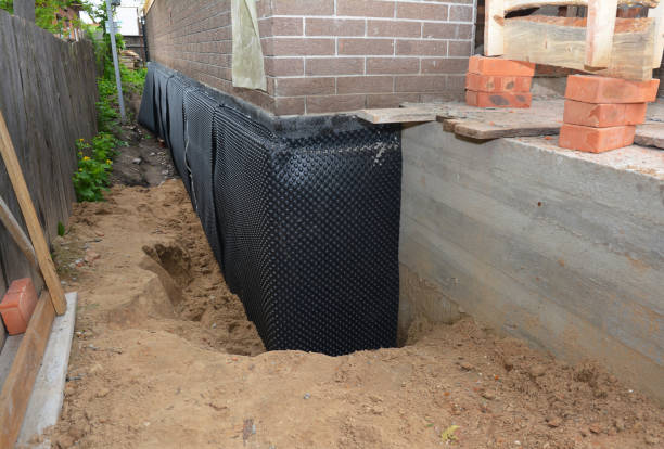 Happy homeowners after waterproofing job in Henryville